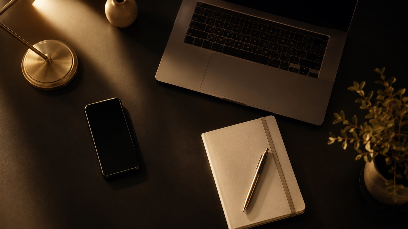 One long video on a laptop fanning out into short clips on phone screens in warm light